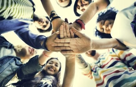 College Students Teamwork Stacking Hand Concept College Students Teamwork Stacking Hand Concept